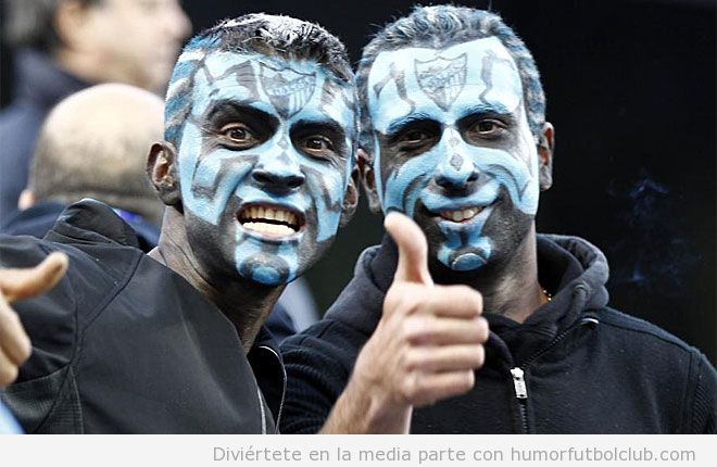 Aficionados en el Málaga vs Borussia Dortmund con cara pintada